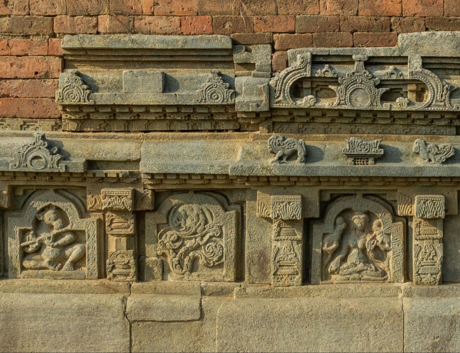 Intricate carvings on the walls of Nalanda