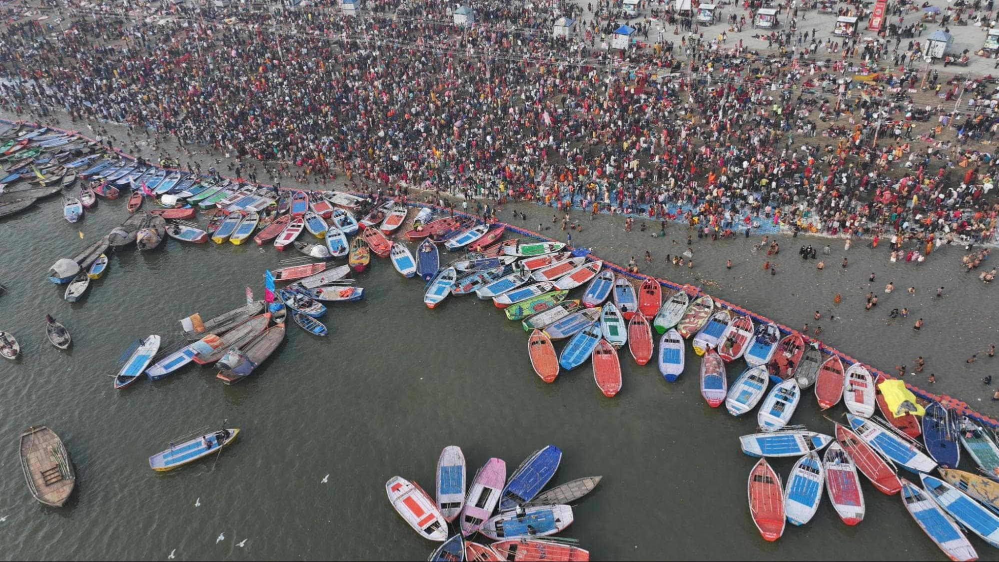 Mass gathering alongside the holy river at Kumbh Mela