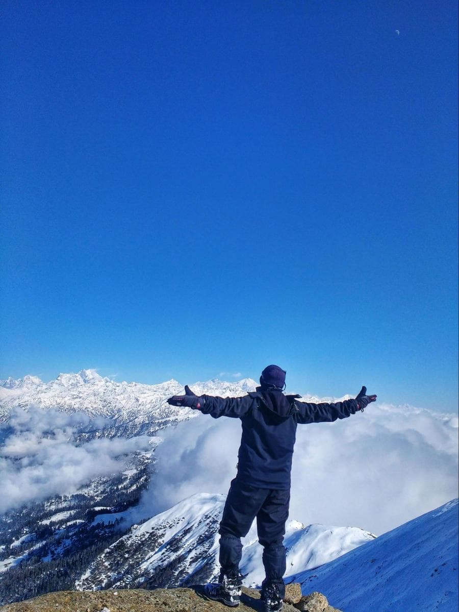 A person standing on a mountain