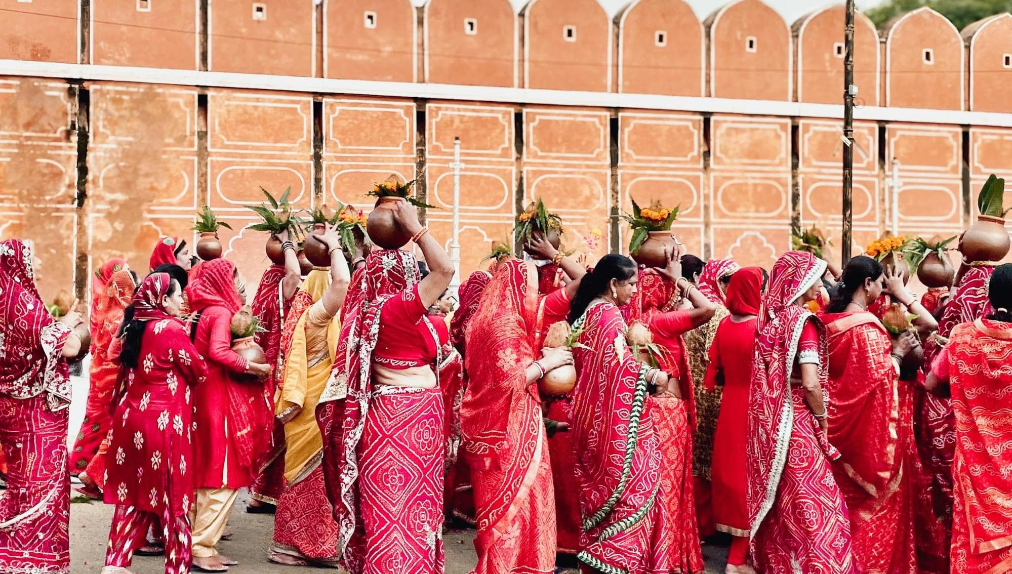 Group of women wearing red saris